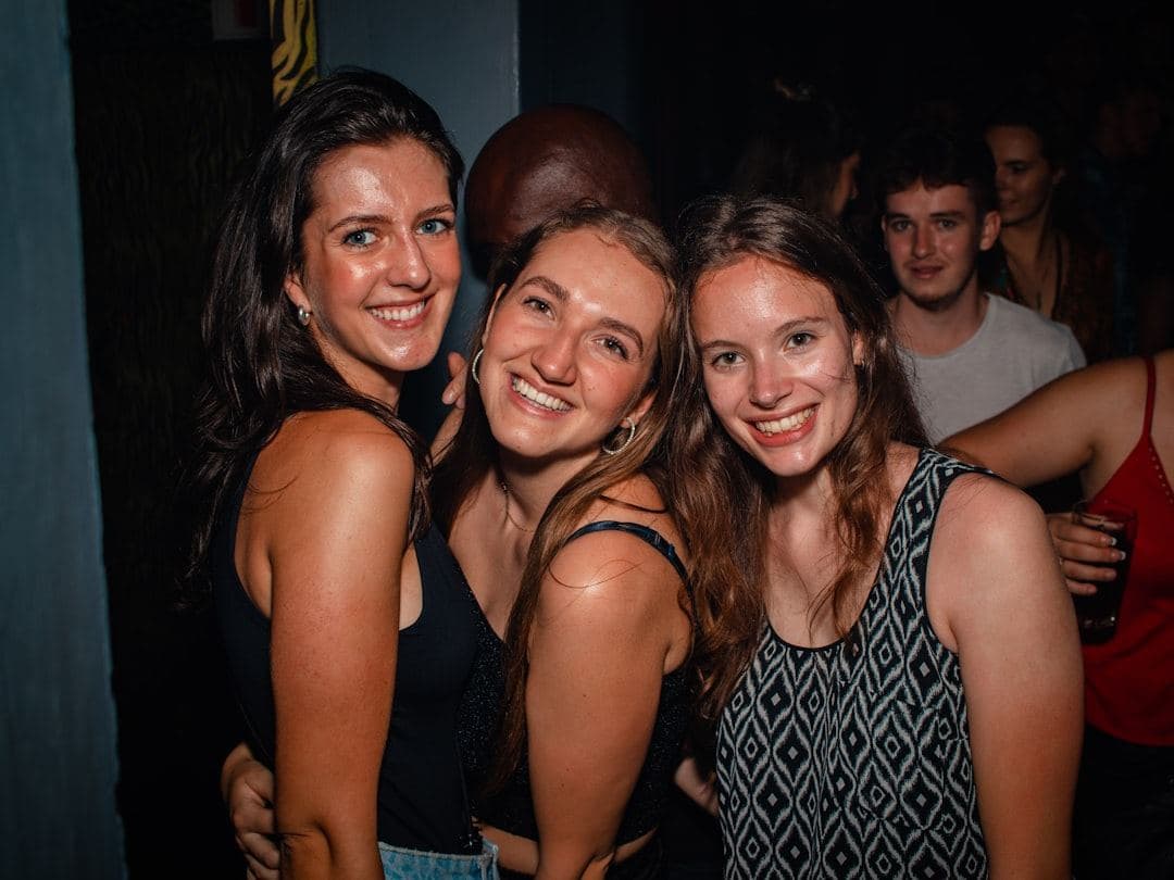 a guest lifting a camera to take a shot on the dancefloor